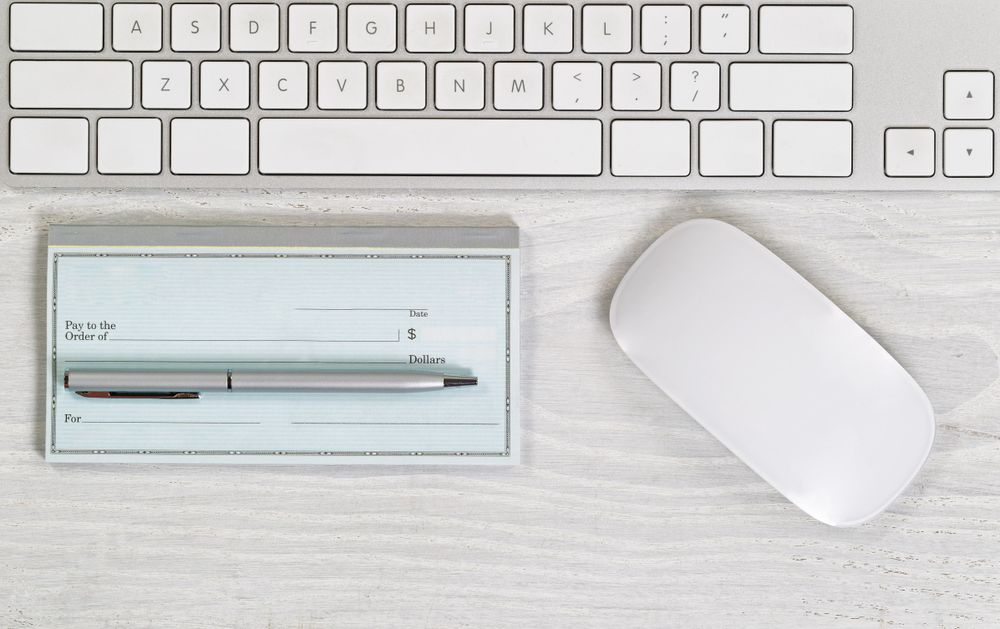 Blank checkbook on light desktop