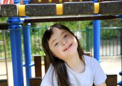 Young child playing on outdoor playset