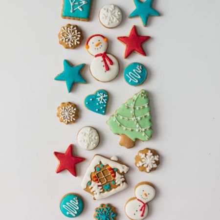 Pattern of Christmas cookies and red berries