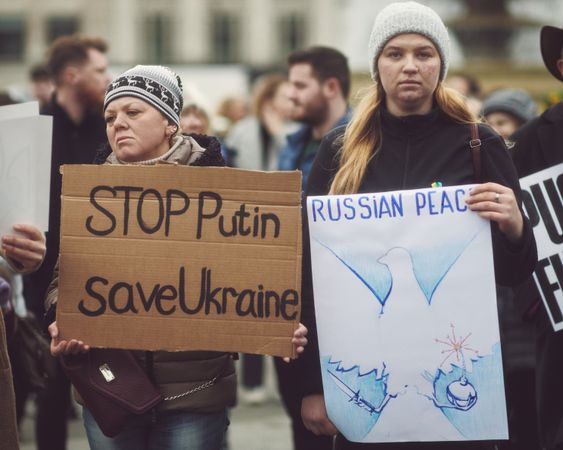 London, England, United Kingdom - March 5 2022: Two women with “stop Putin” and “Russian Peace” sign