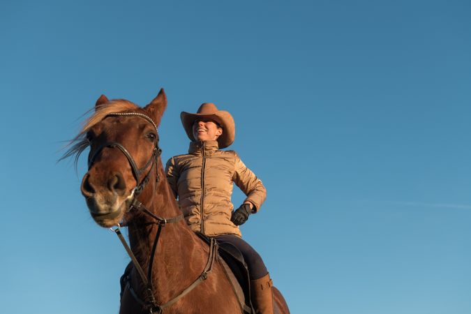 Woman on horse in field