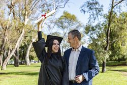 Happy graduate with her father on her graduation