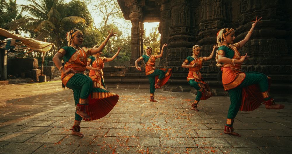 Portrait of Expressive Young Females Dancing Folk Dance Choreography in Temple.