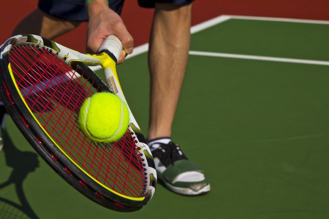 Person doing forehand or slice on tennis court