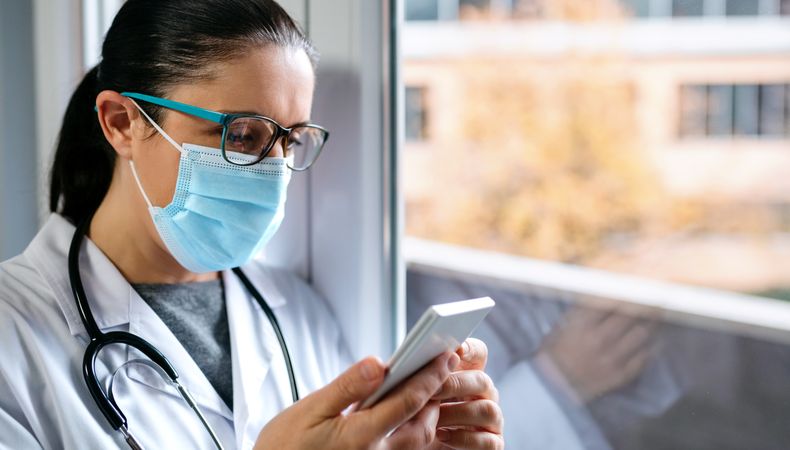 Female doctor chatting on the phone