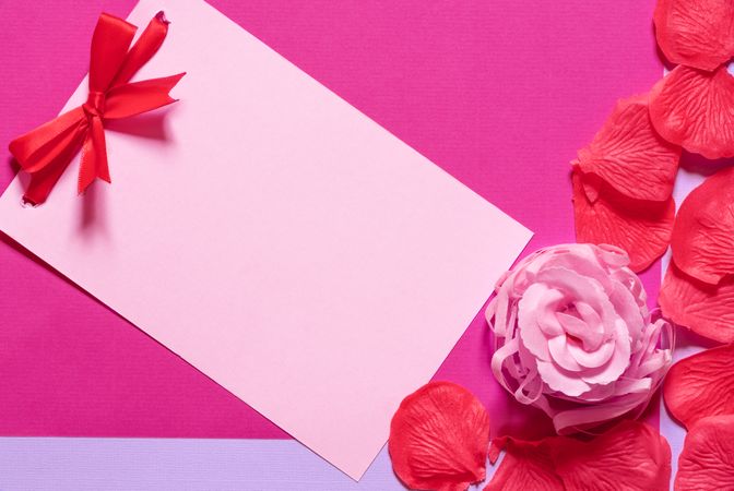 Message card with bow and rose petals with copy space