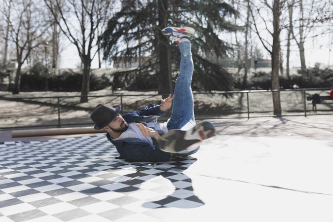 Man dancing break dance in park