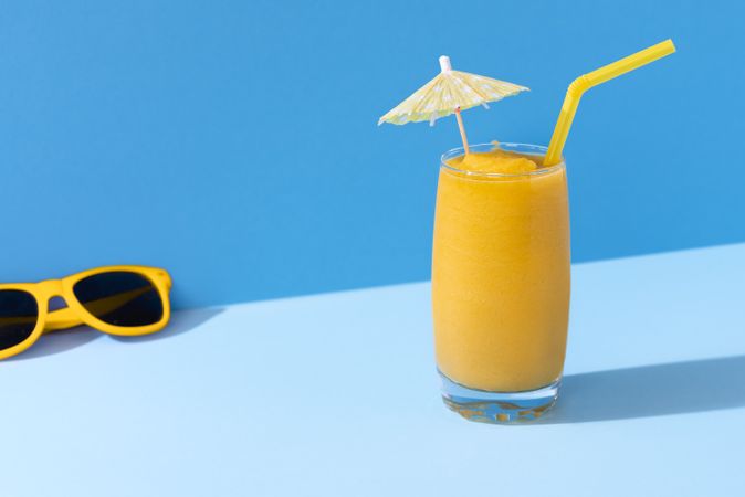Mango smoothie and sunglasses