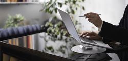 Businessman Working on Laptop at Office Desk