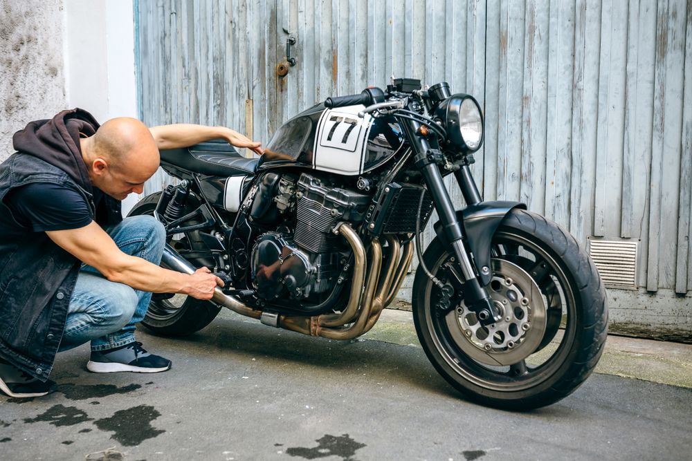 Biker checking with a motorcycle