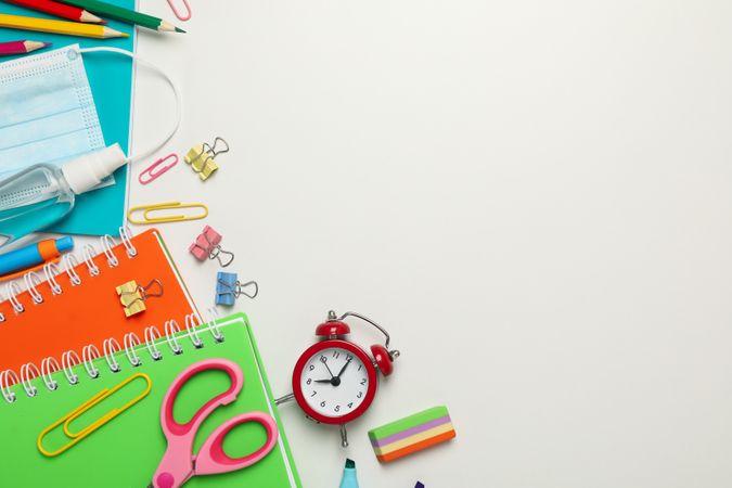Frame of school supplies on blank background, space for text