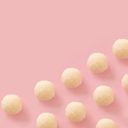 Chocolate balls on a soft pink background