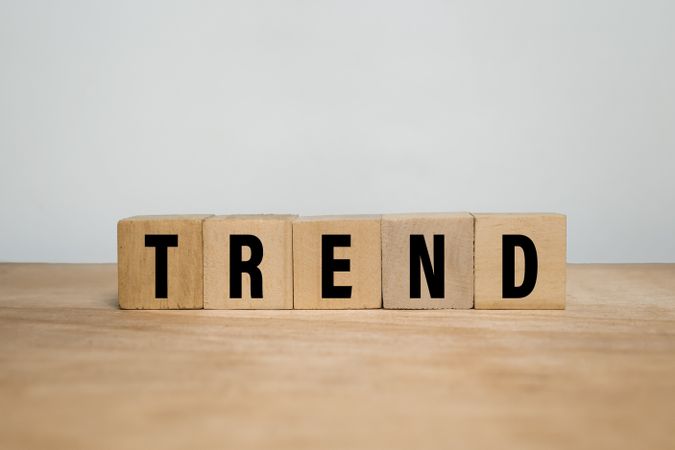 trend words text on wooden blocks on wooden surface