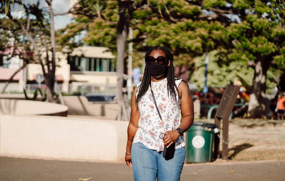 Woman with facemask walking outdoor