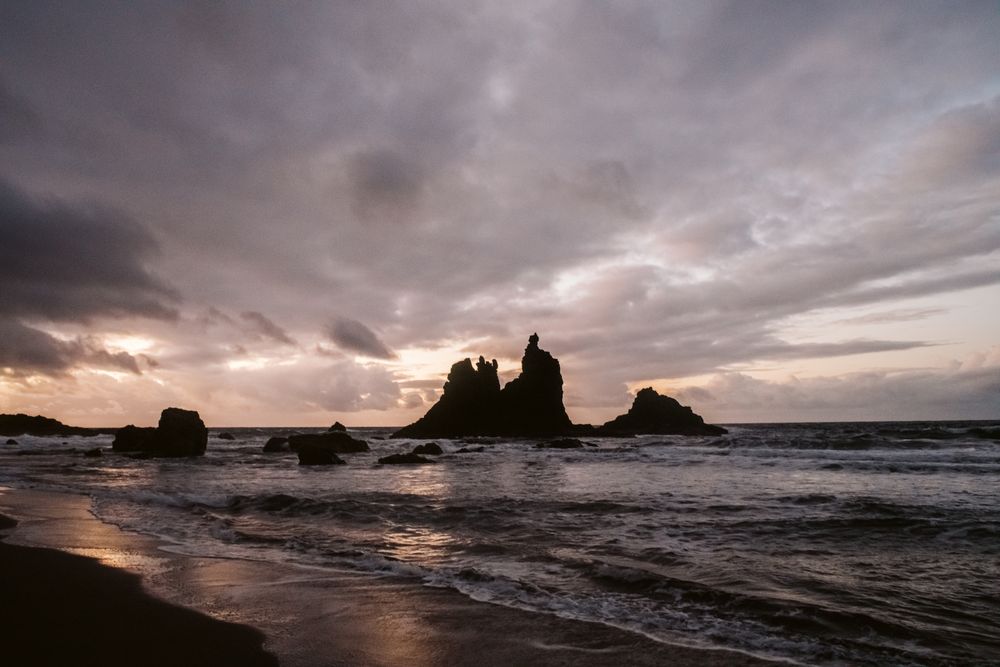 Lonely cliff in sea on cloudy day