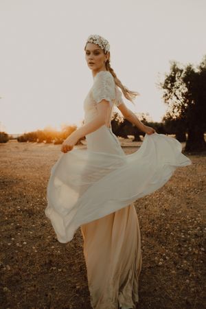 Woman in dress posing on nature