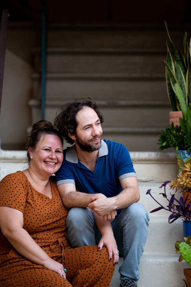 Portrait of loving married couple sitting together outside
