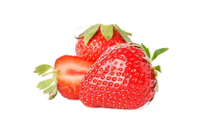 Strawberries isolated on light background. Summer sweet fruits and berries