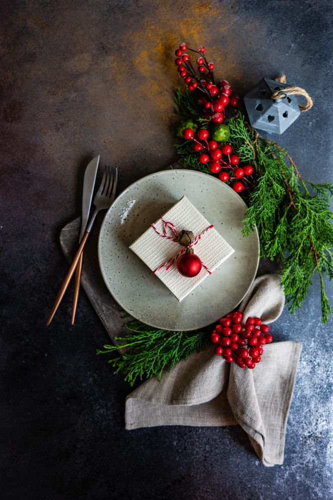 Top view of gift on Christmas table setting