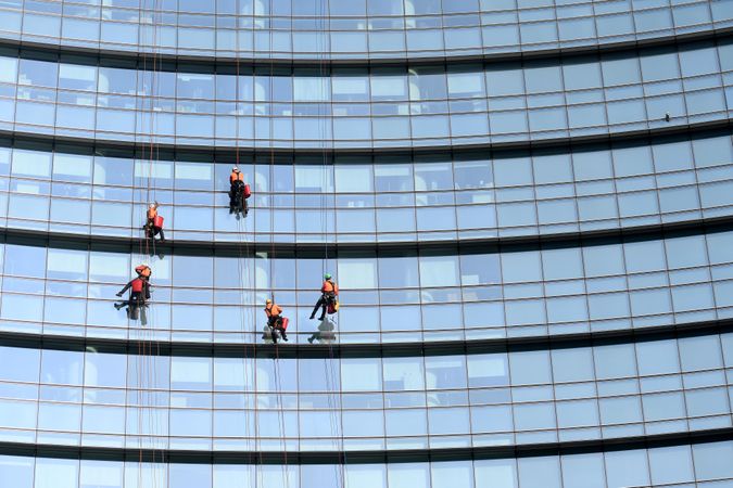 People cleaning windows of a skyscraper