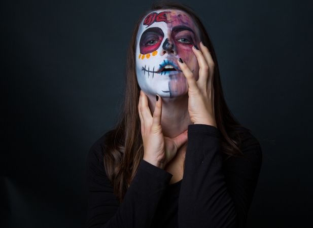 Young woman with creepy face paint