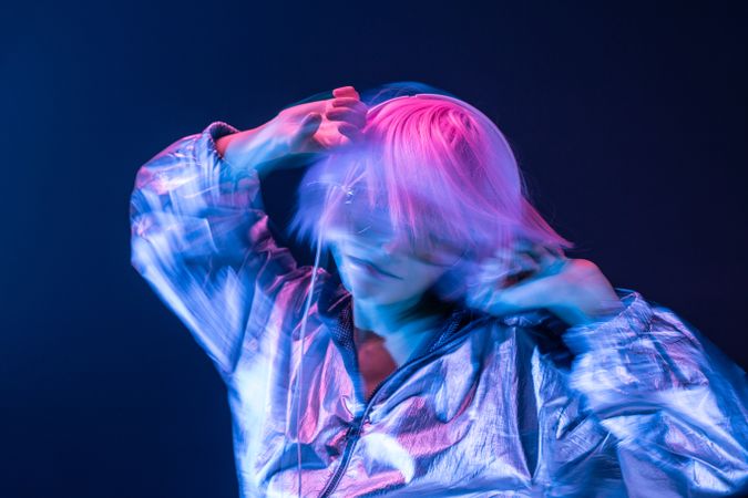 Woman dancing while listening to music