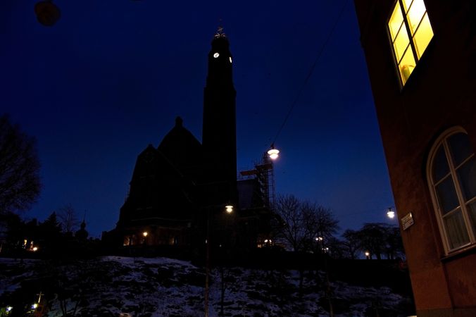 Building with clock tower at night