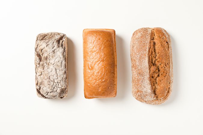 Flat lay composition with bakery products on blank background, space for text
