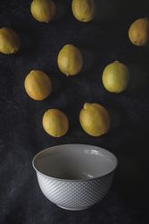 Fresh lemons on dark background.