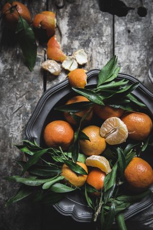 Mandarins and basket on table