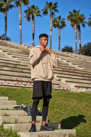 Hispanic sportsman standing on stairs
