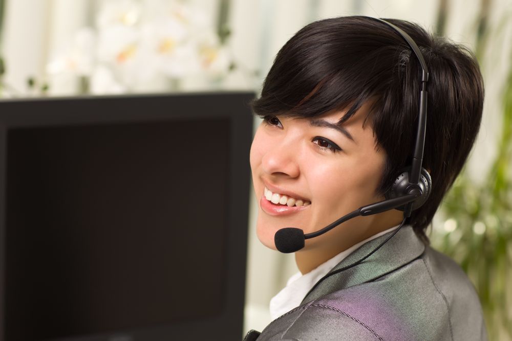Young Woman Smiles Wearing Headset