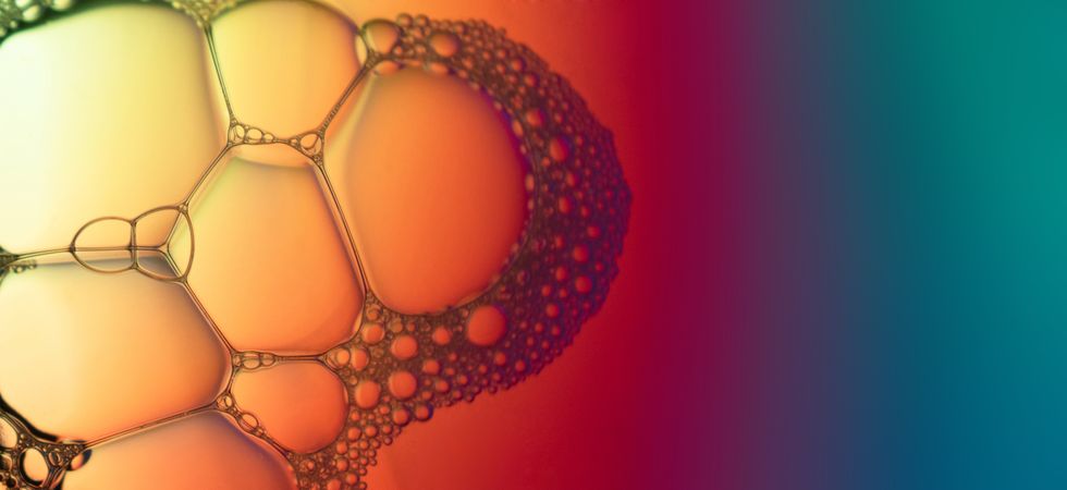Abstract background bio technology, macro photography foam and water with gradient background. Molecule multicolor backgorund