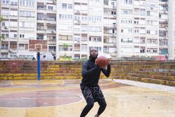 Young Black Man Playing Basketball.