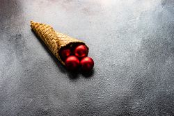 Christmas concept of cone with red baubles