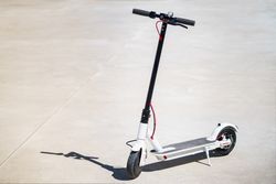 Electric scooter parked in the sun