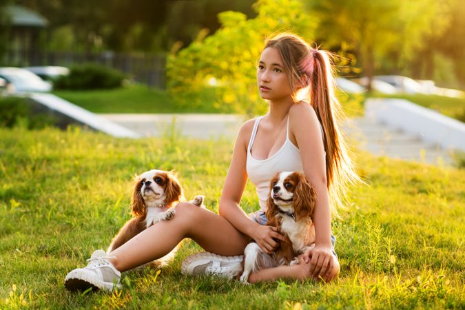 Teen girl sits with the dog