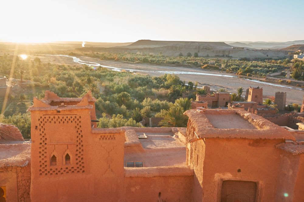 Ancient city near river in desert and wonderful sky