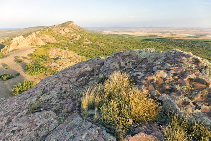 Valley with rocky hills in sunlight