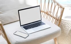 Laptop on table with blank mock up screen