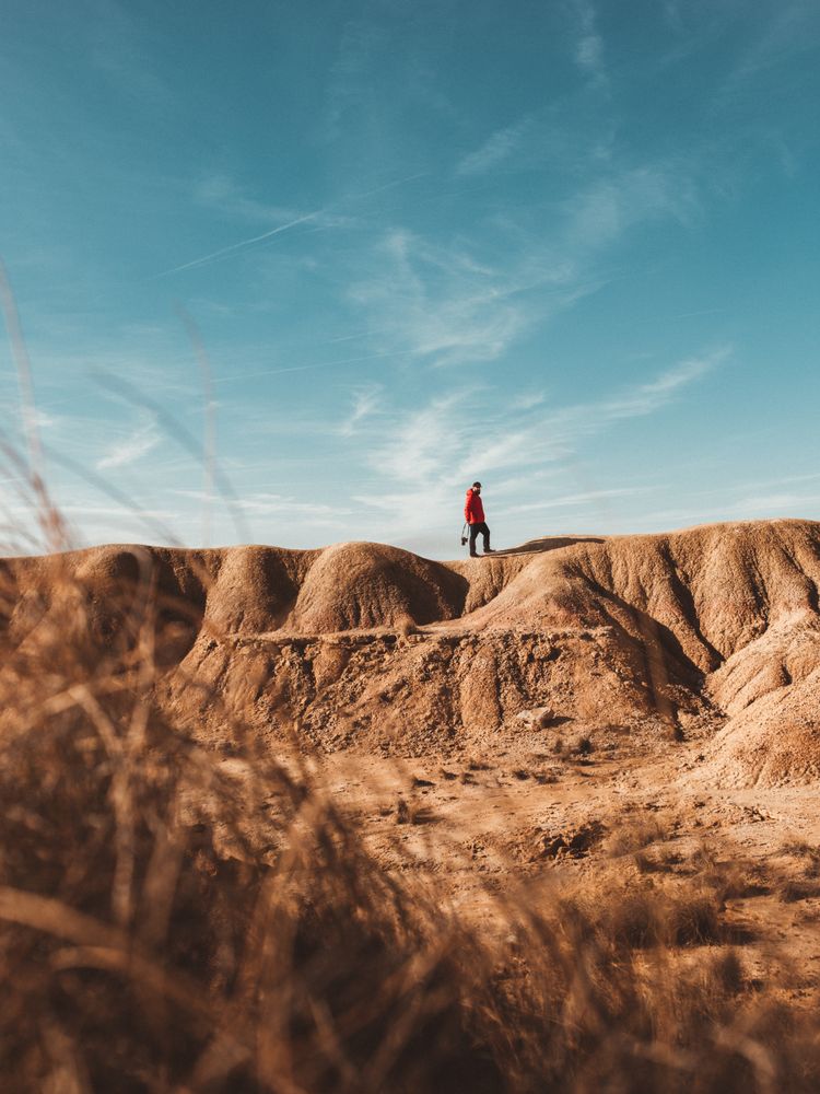 Tourist on sandy canyon hills