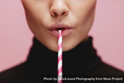 Face of a woman with straw 5Q2g7N