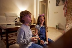 Children playing video games at home