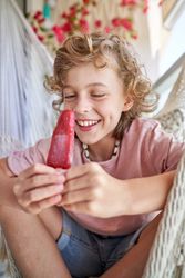 Delighted kid looking at ice cream