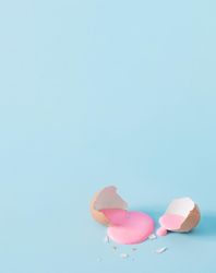 Open eggshell with pastel pink paint