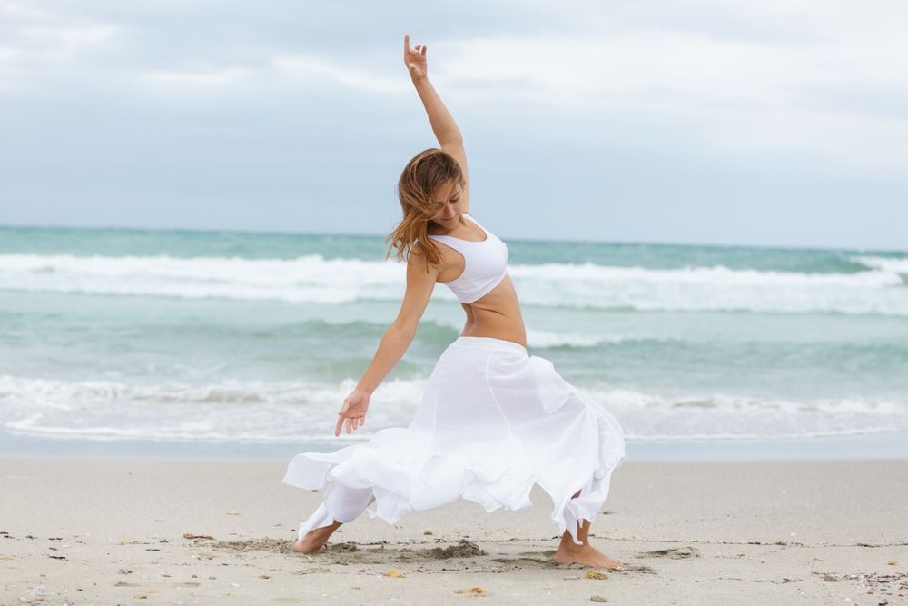 woman dancing near sea