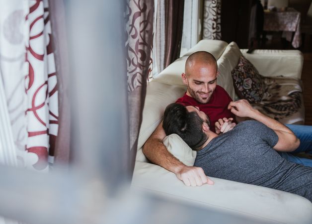 young gay couple at home