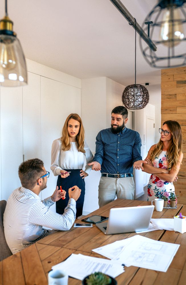 Businesspeople asking for explanations to a employee