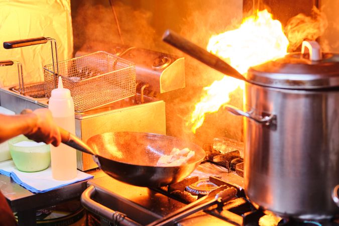 Saucepan with Fire in Restaurant’s Kitchen