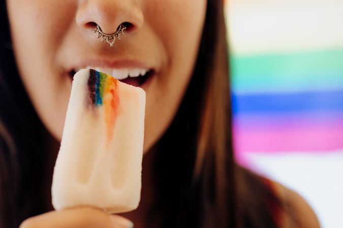 Woman eating ice cream with LGBTQIA symbol